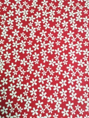 Tissu - Coton - Fleurs blanches sur fond rouge