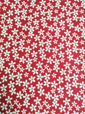 Tissu - Coton - Fleurs blanches sur fond rouge